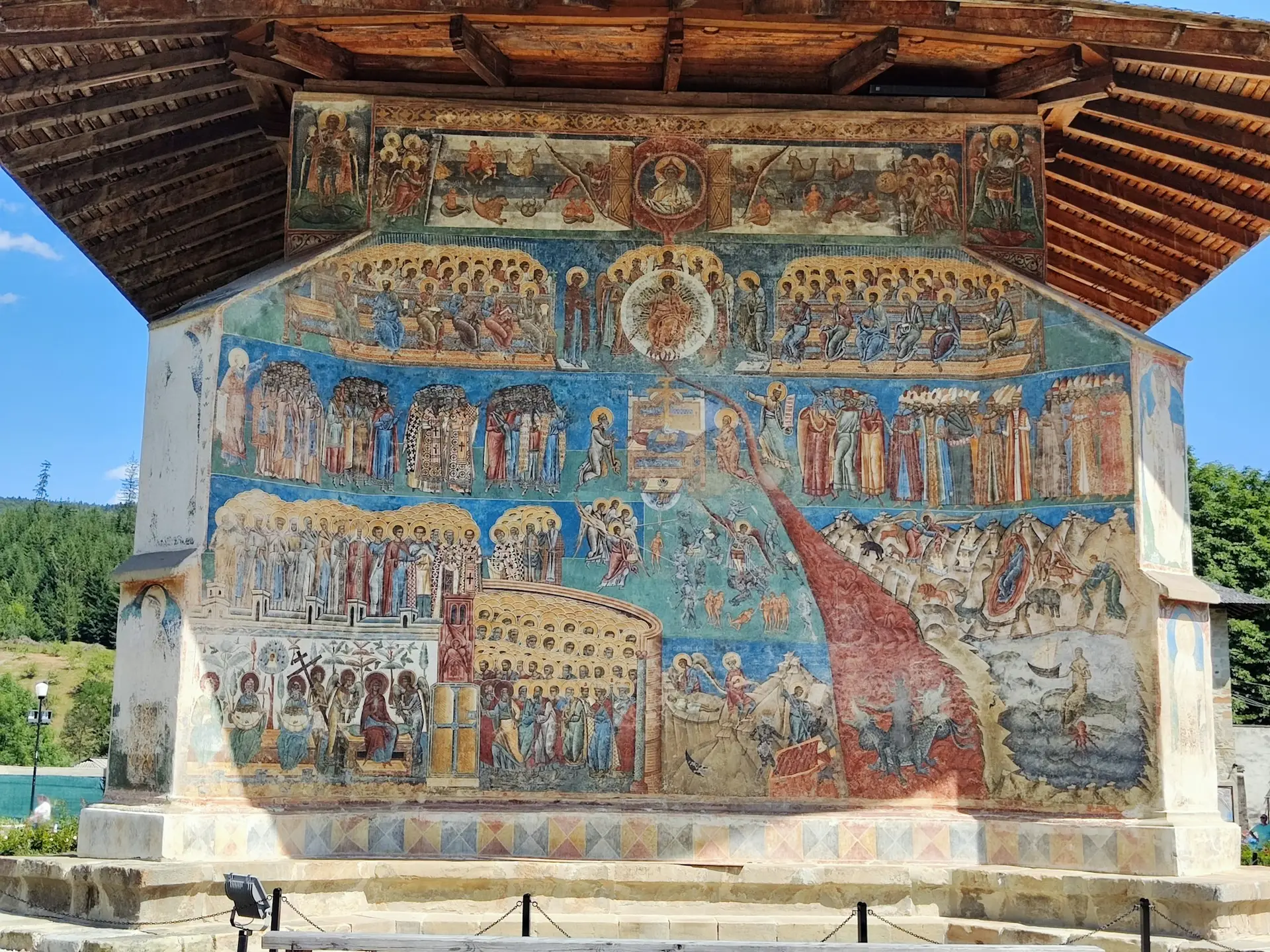 Blue-toned Orthodox frescoes on the exterior wall of Voroneț Monastery in Bucovina.